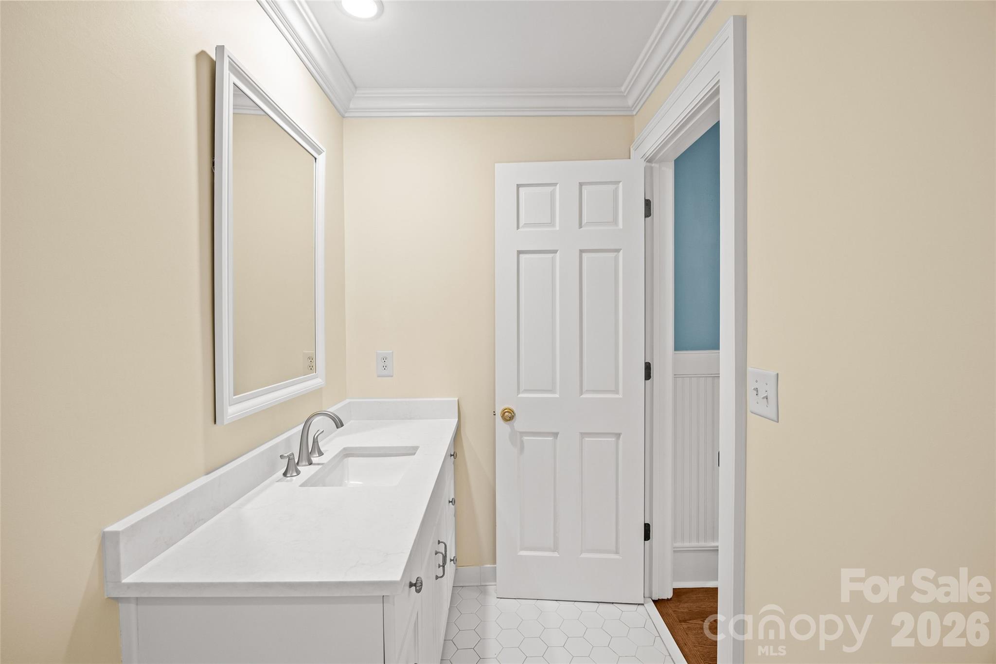 640 Colville Road Charlotte, NC 28207 - Photo 39 of 48 a bathroom with a sink and a mirror