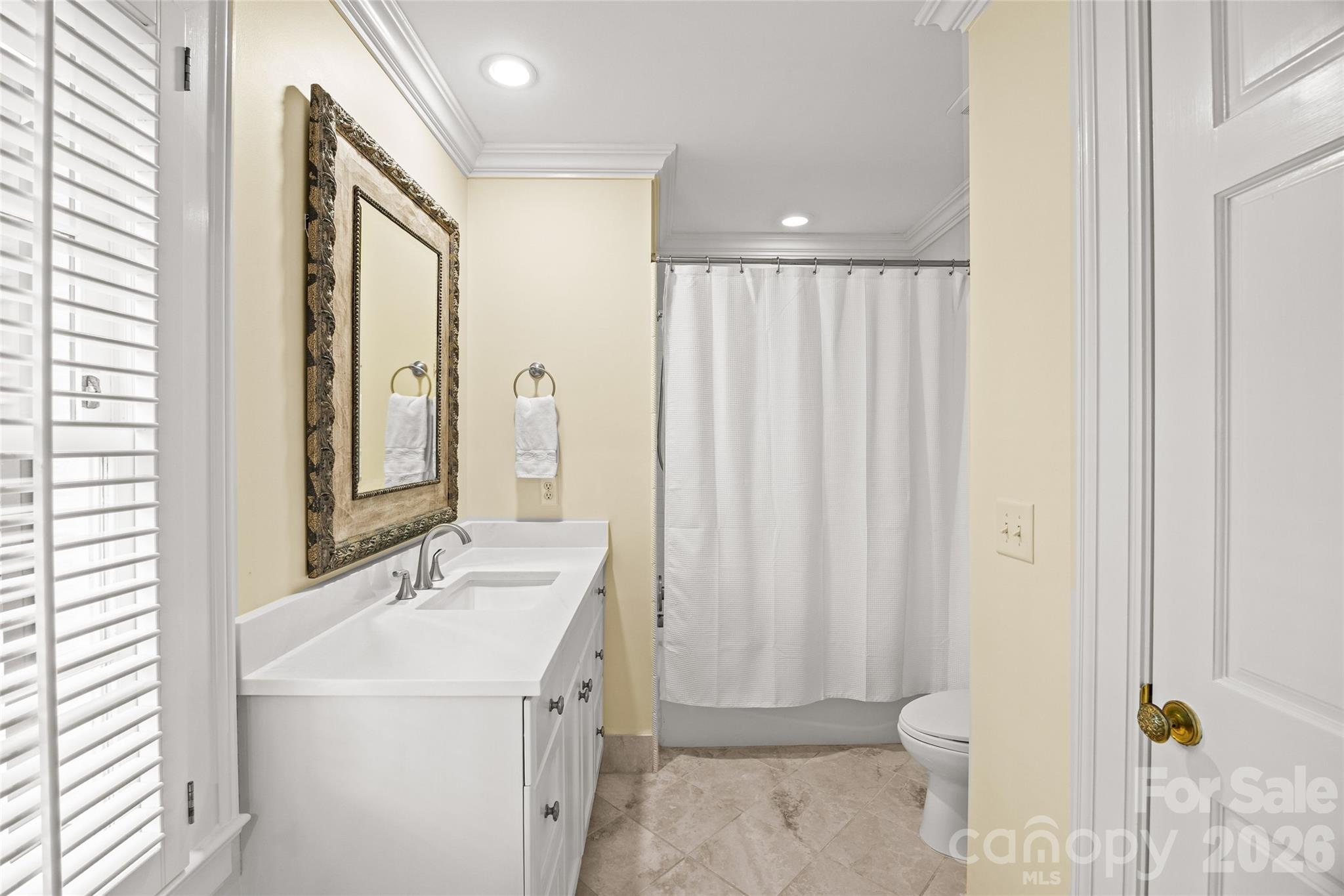 640 Colville Road Charlotte, NC 28207 - Photo 44 of 48 a bathroom with a sink toilet and shower