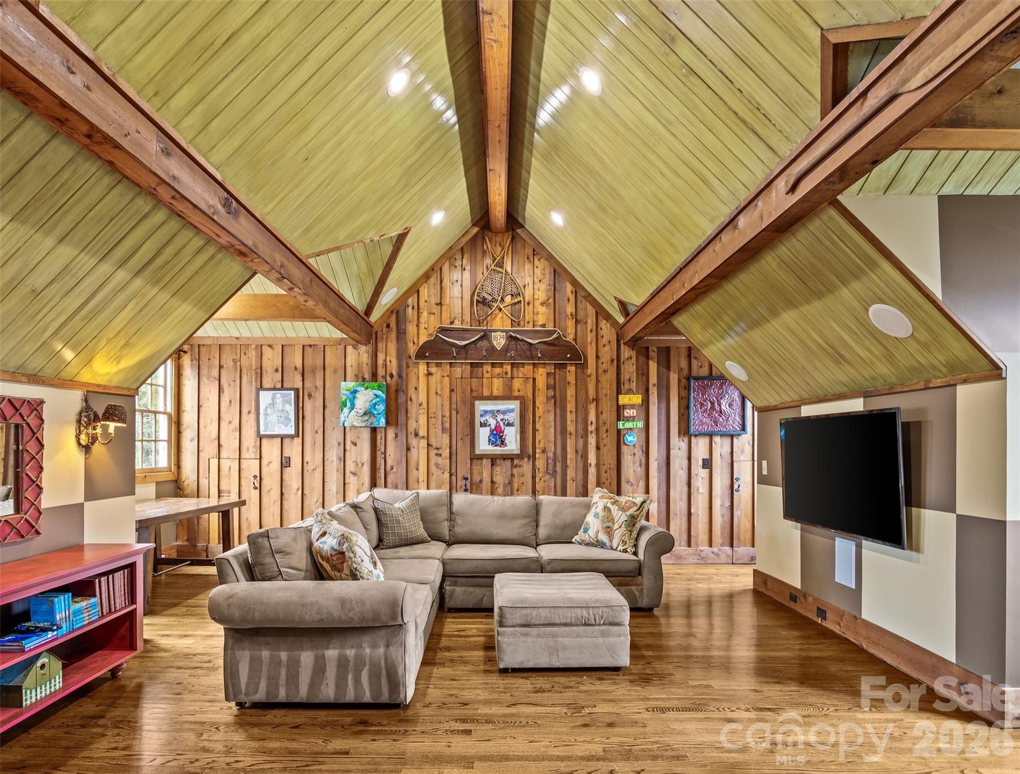 640 Colville Road Charlotte, NC 28207 - Photo 45 of 48 a living room with furniture a flat screen tv and a floor to ceiling window