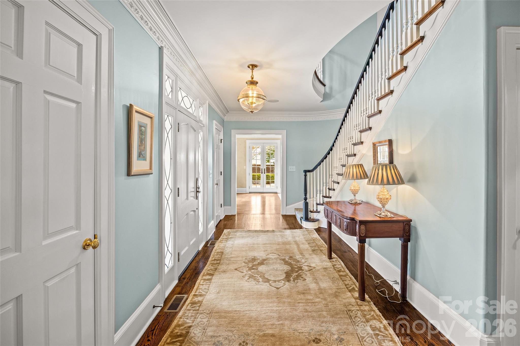 640 Colville Road Charlotte, NC 28207 - Photo 5 of 48 a view of an entryway with wooden floor and stairs