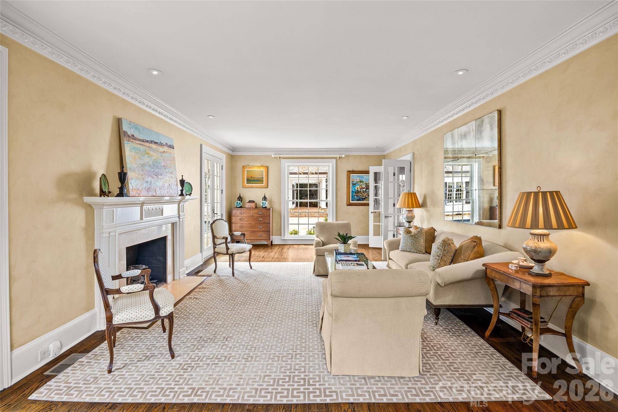 640 Colville Road Charlotte, NC 28207 - Photo 6 of 48 a living room with furniture and a fireplace