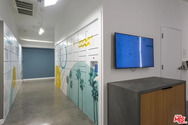 a living room with furniture and a lamp