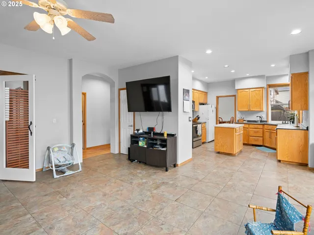 a living room with furniture and flat screen tv