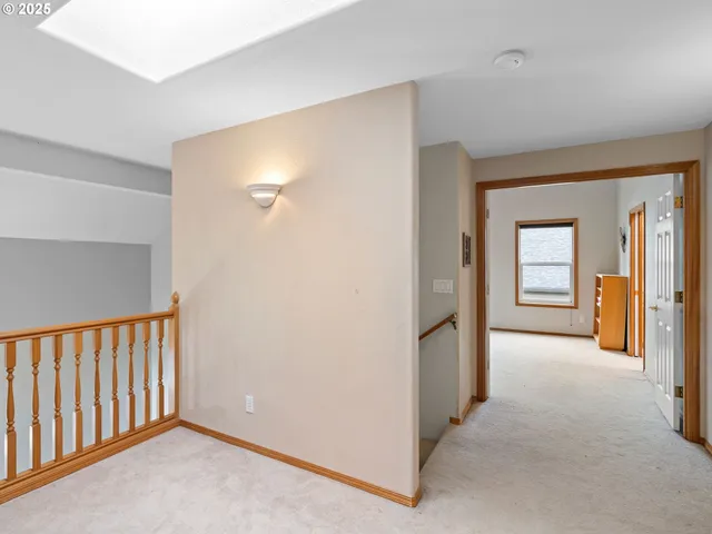 a view of a hallway with wooden shelves