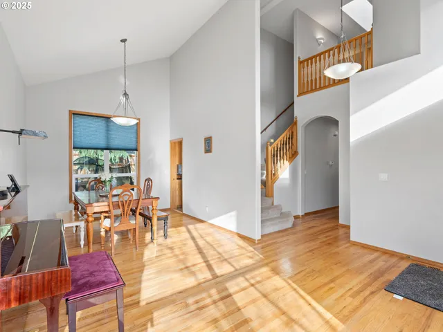 a view of a livingroom with furniture window and wooden floor