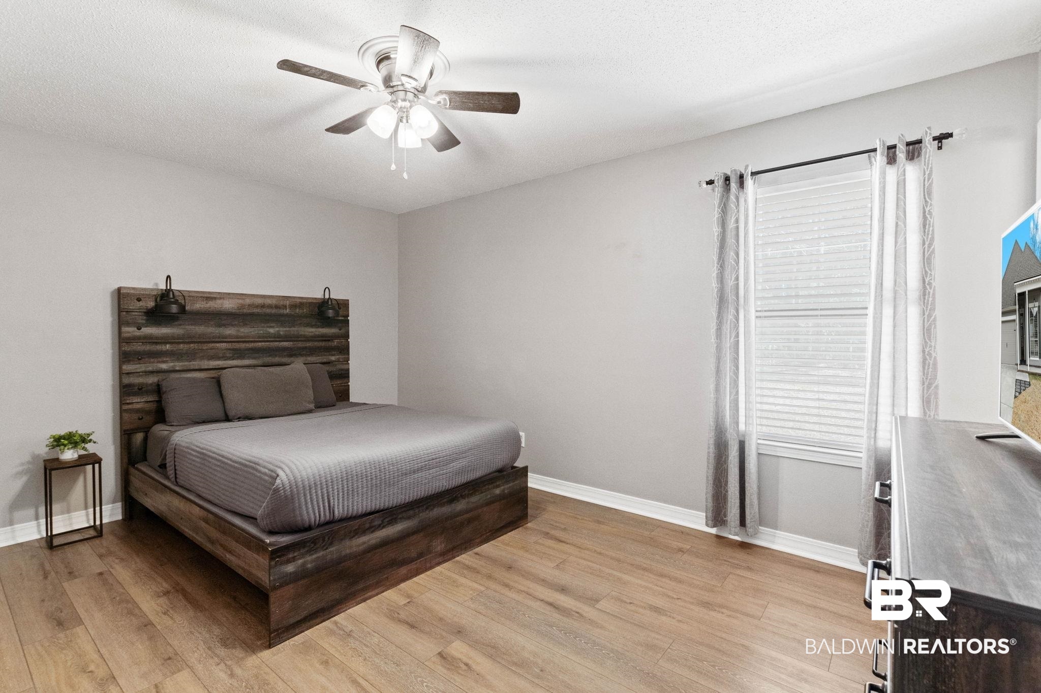 5366 Scanlan Way West Satsuma, AL 36572 - Photo 13 of 43 Bedroom featuring a ceiling fan and light wood-style flooring