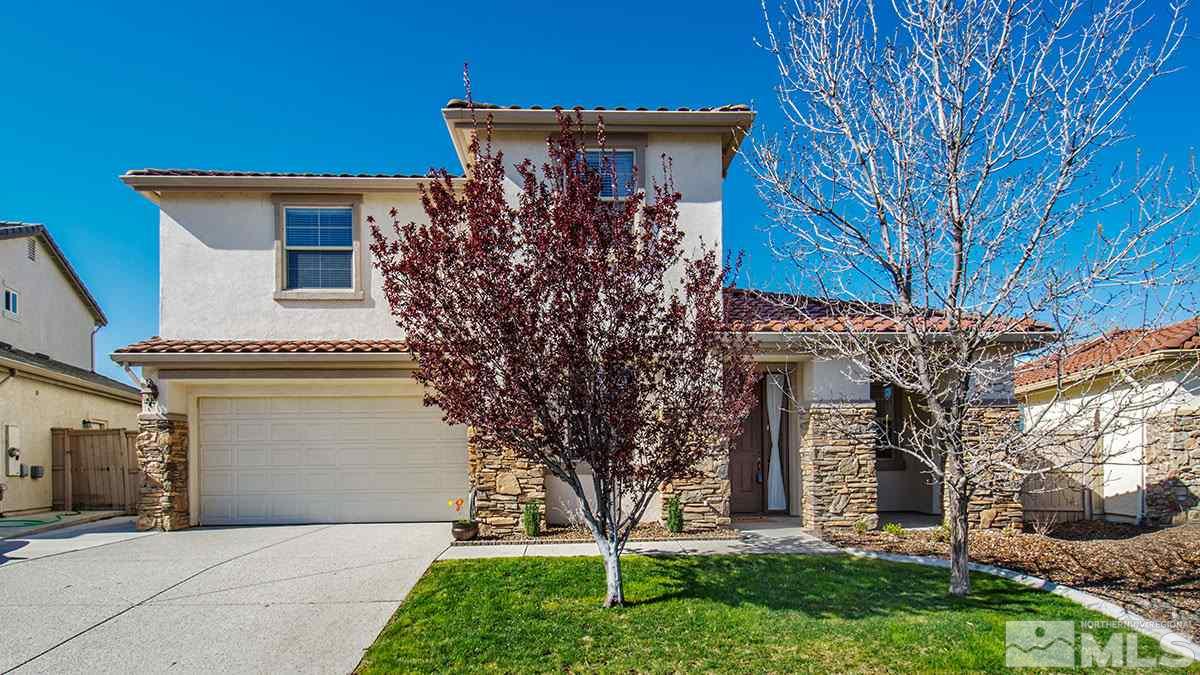 10671 Fire Poppy Circle Reno, NV 89521 - Photo 1 of 1 a front view of a house with garden