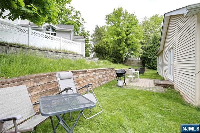 84 12th Street Cresskill, NJ 07626 - Photo 39 of 45 a view of backyard with seating area and green space