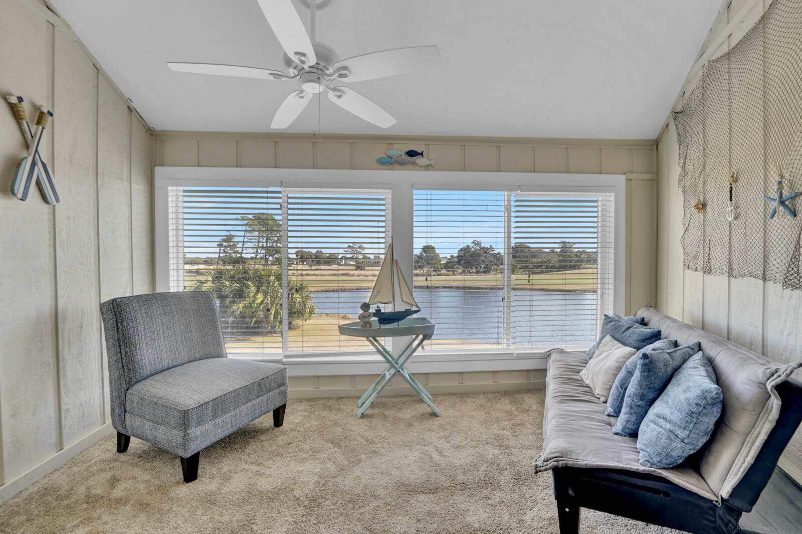 4725 Bay Point Road, Unit 261 Panama City Beach, FL 32408 - Photo 18 of 38 a living room with furniture and a large window