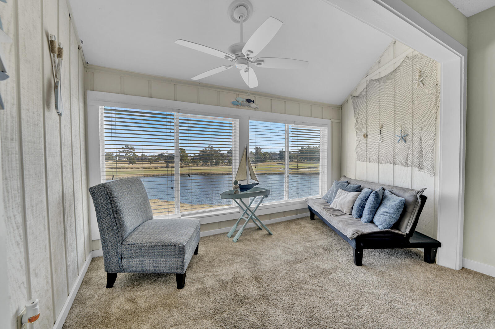 4725 Bay Point Road, Unit 261 Panama City Beach, FL 32408 - Photo 19 of 38 a living room with furniture and a large window