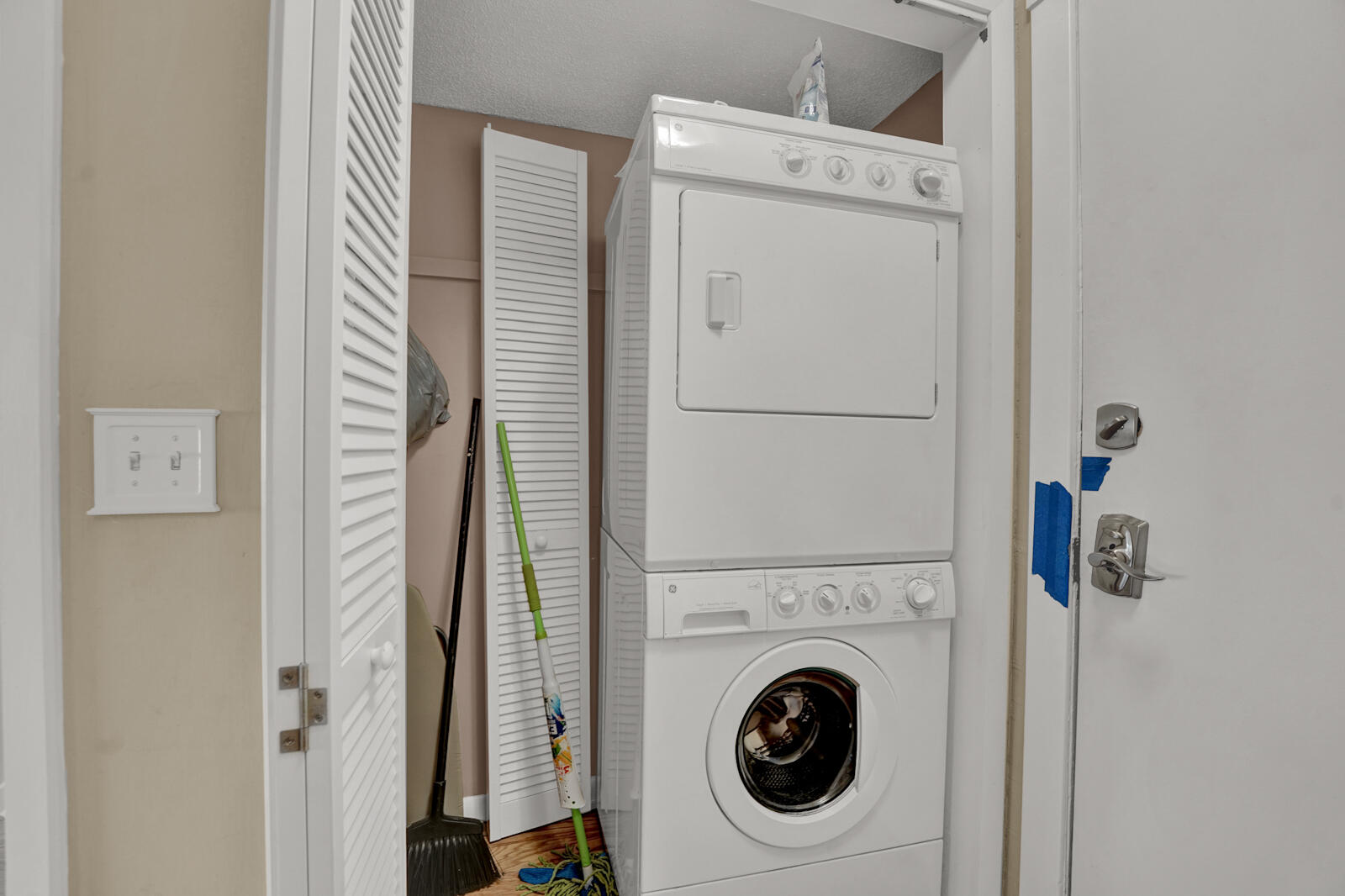 4725 Bay Point Road, Unit 261 Panama City Beach, FL 32408 - Photo 23 of 38 a utility room with dryer and washer