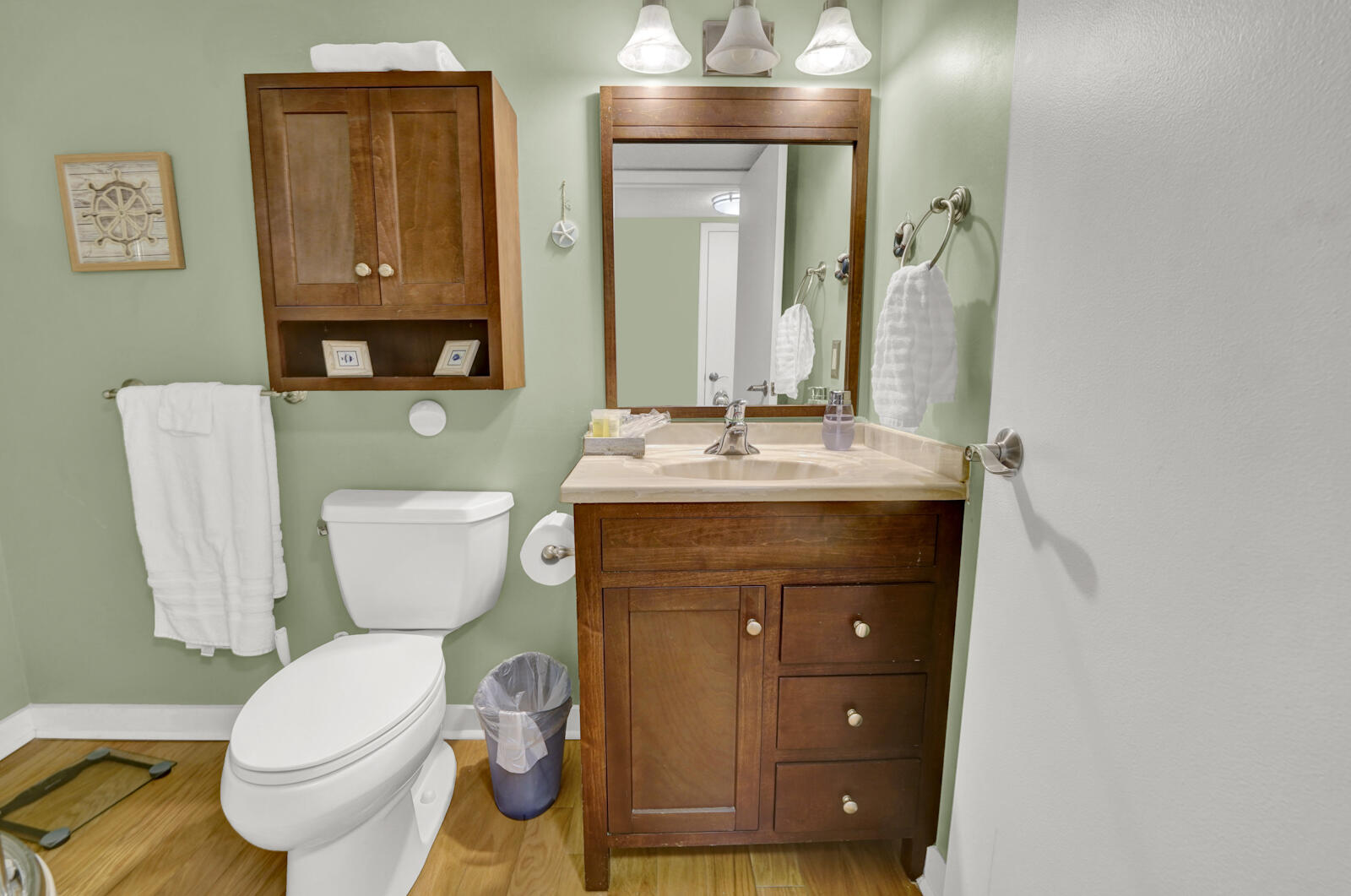 4725 Bay Point Road, Unit 261 Panama City Beach, FL 32408 - Photo 24 of 38 a bathroom with a toilet sink and mirror
