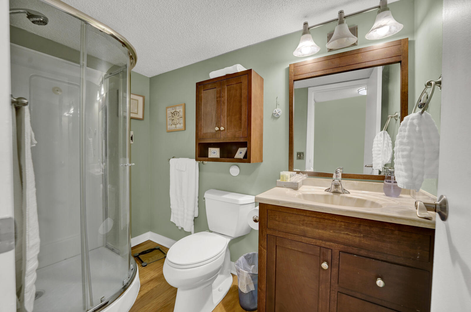 4725 Bay Point Road, Unit 261 Panama City Beach, FL 32408 - Photo 25 of 38 a bathroom with a sink vanity mirror and toilet