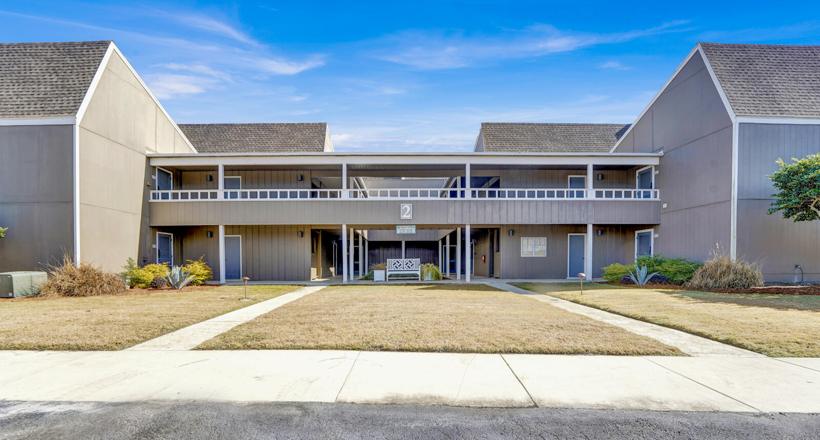 4725 Bay Point Road, Unit 261 Panama City Beach, FL 32408 - Photo 27 of 38 a view of a building with a umbrellas