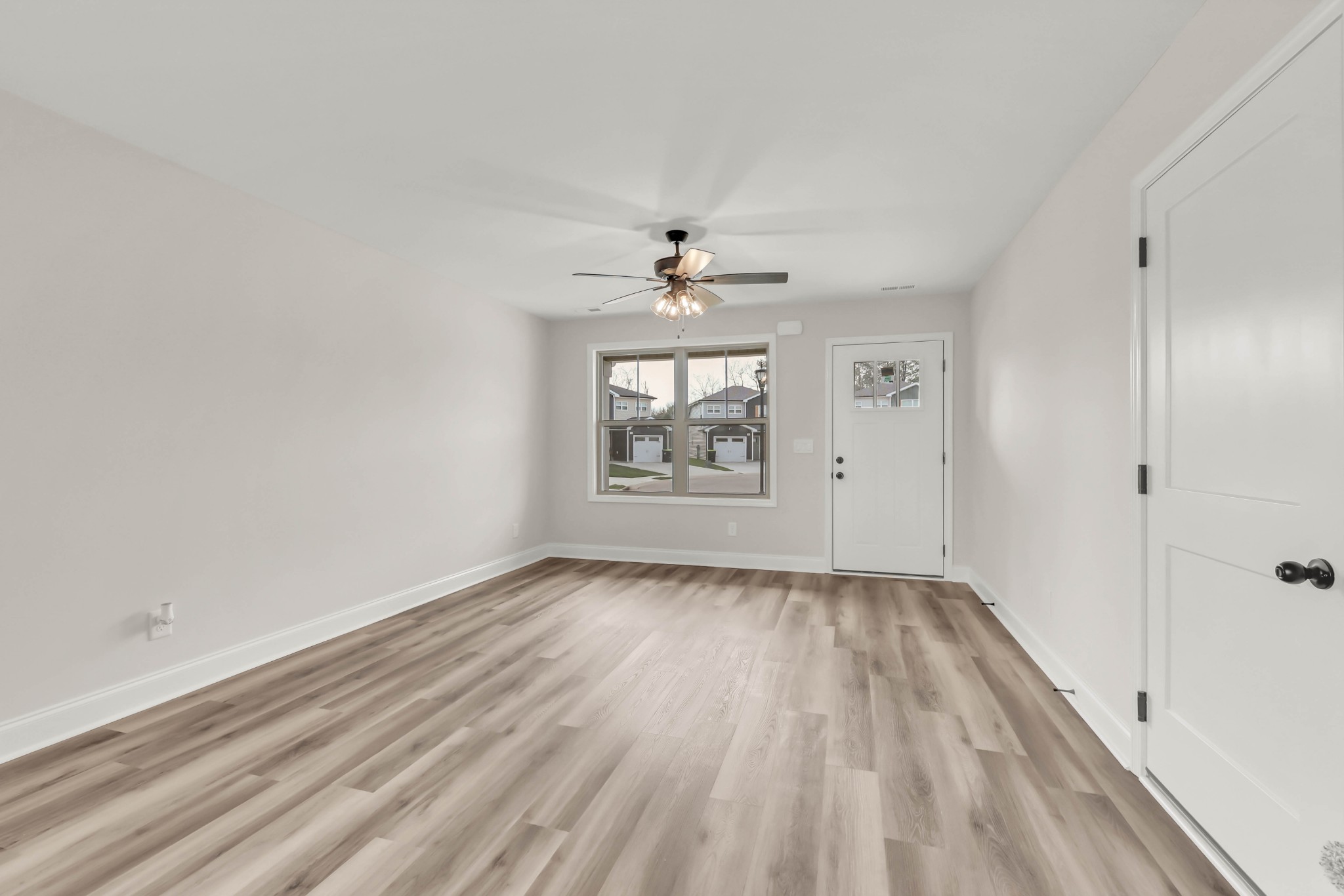 195 Quarry View Clarksville, TN 37043 - Photo 9 of 33 wooden floor in an empty room with a window