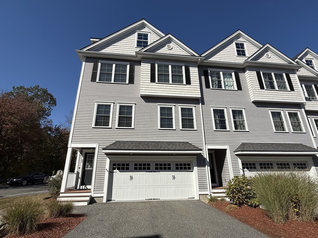 66 Compass Point, Unit 66 North Andover, MA 01845 - Photo 1 of 42 a view of a brick house with large windows