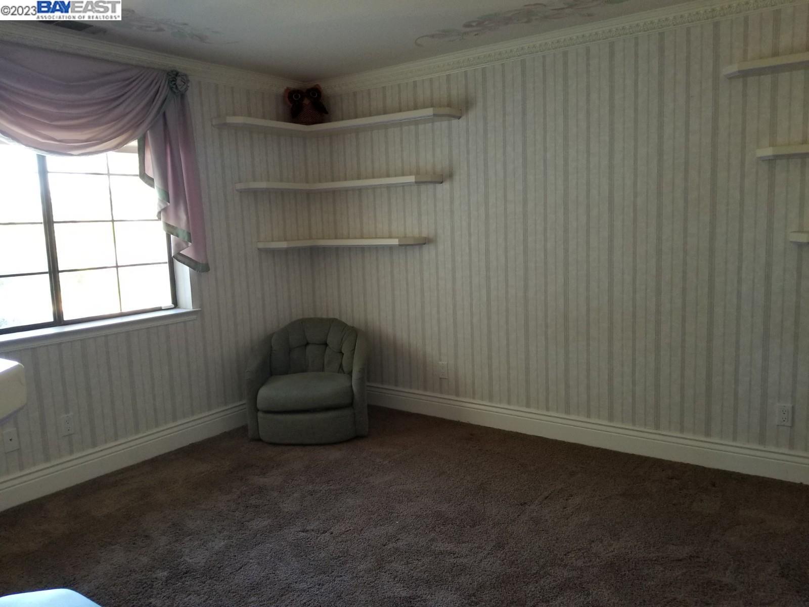 502 Regulus Road Livermore, CA 94550 - Photo 17 of 27 a room with a chair and a window