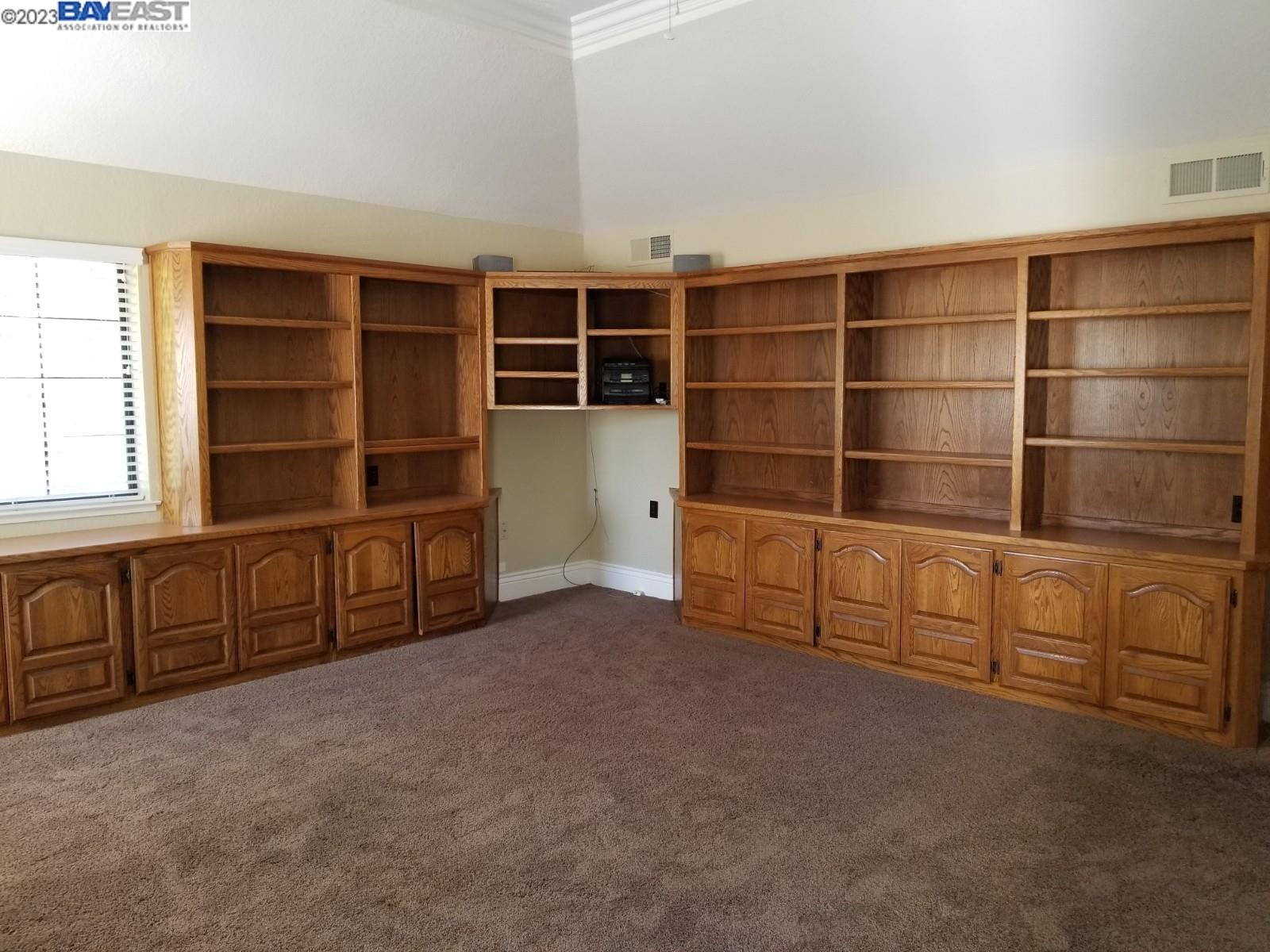 502 Regulus Road Livermore, CA 94550 - Photo 19 of 27 a view of an empty room with cabinet and a large window