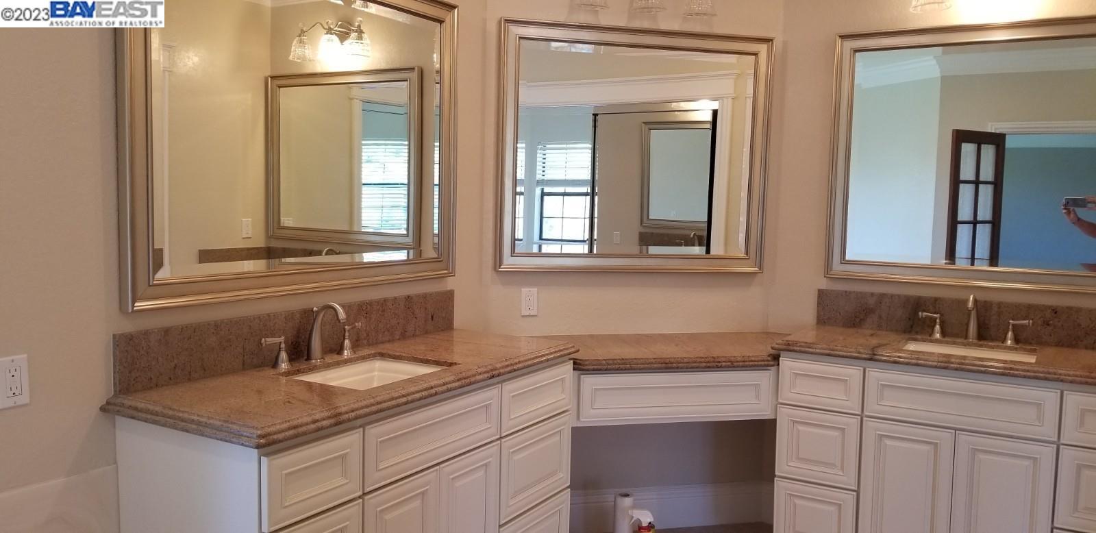 502 Regulus Road Livermore, CA 94550 - Photo 24 of 27 a bathroom with a sink and a mirror