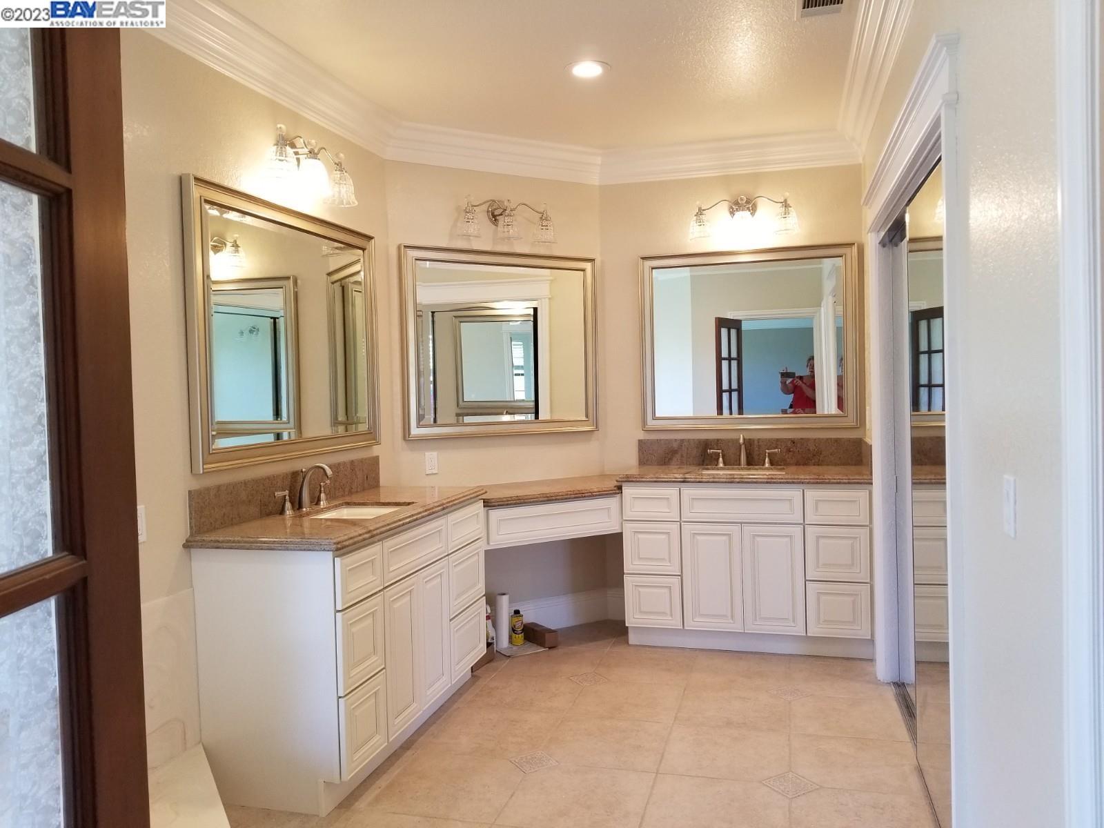 502 Regulus Road Livermore, CA 94550 - Photo 25 of 27 a spacious bathroom with a granite countertop sink mirror and bathtub