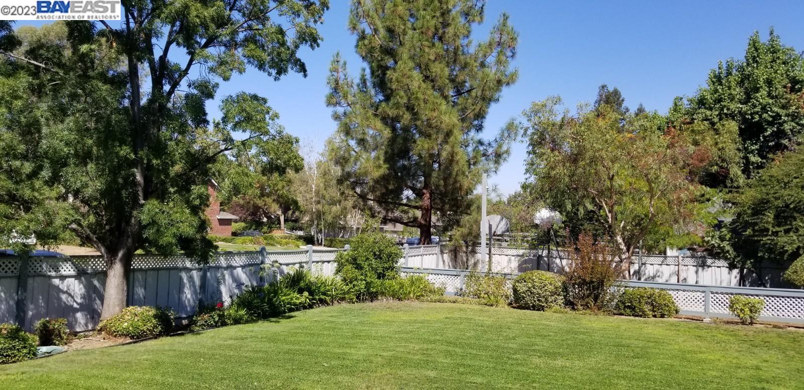 502 Regulus Road Livermore, CA 94550 - Photo 26 of 27 a view of a backyard with large trees