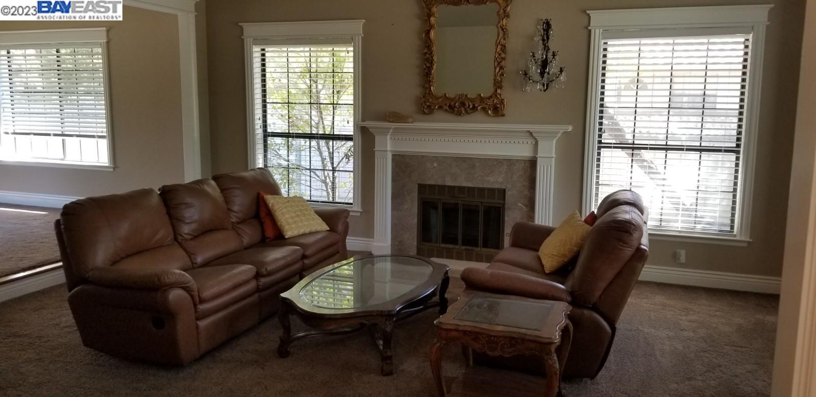 502 Regulus Road Livermore, CA 94550 - Photo 3 of 27 a living room with furniture and a fireplace