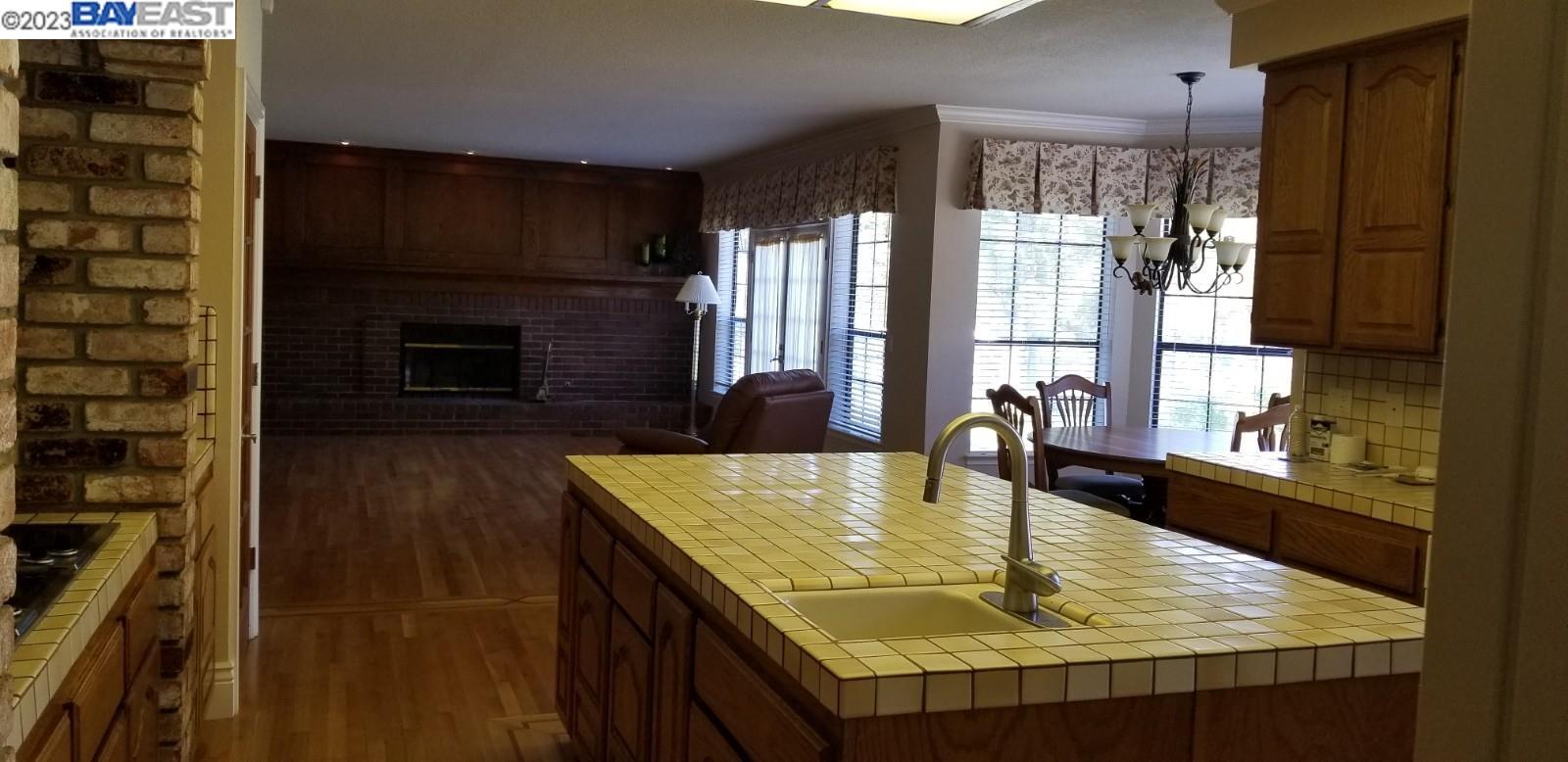 502 Regulus Road Livermore, CA 94550 - Photo 4 of 27 a dining table with a fireplace