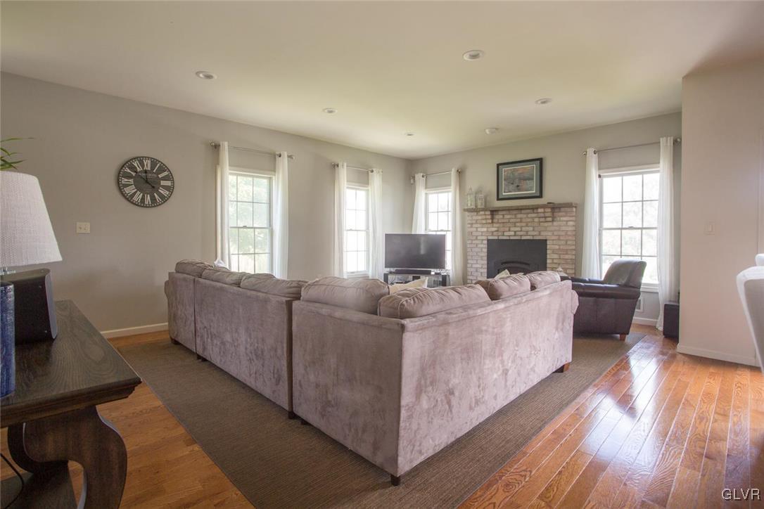 5545 Bridle Road Stroudsburg, PA 18360 - Photo 8 of 36 a living room with furniture and a fireplace