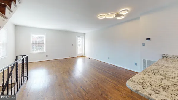 a view of a livingroom with wooden floor