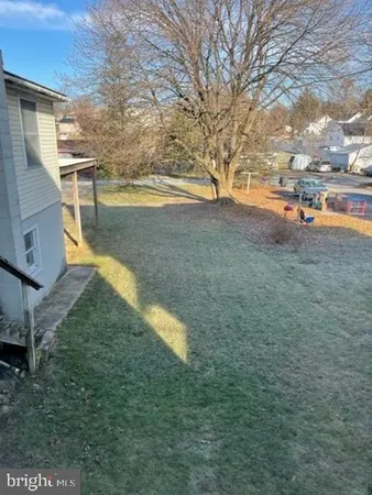 a backyard of a house with lots of green space