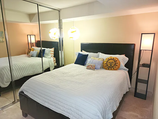 a bedroom with a bed and a closet