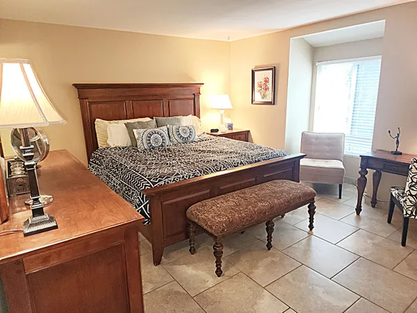 a kitchen with stainless steel appliances granite countertop a refrigerator and a stove