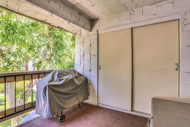 a bedroom with a bed and a closet