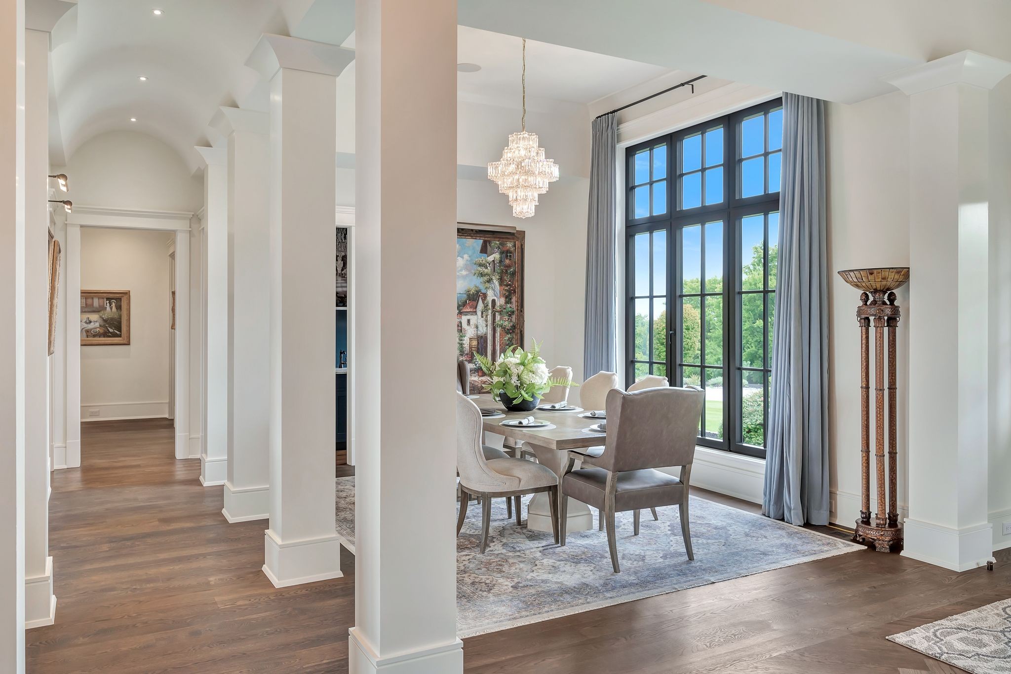 467 Canterbury Rise Franklin, TN 37067 - Photo 11 of 100 a dining room with wooden floor a chandelier a wooden table and chairs