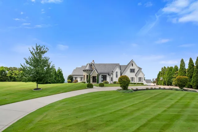 a front view of a house with a yard