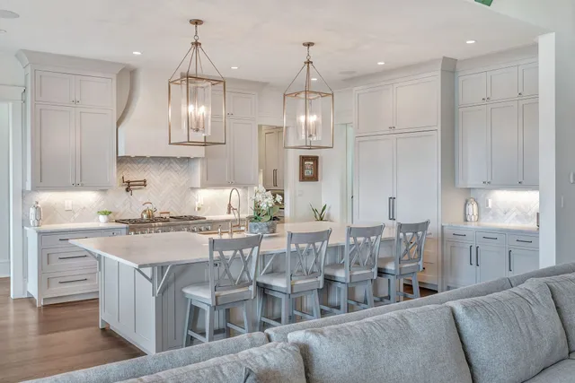 a spacious bathroom with a double vanity sink a mirror and a bathtub
