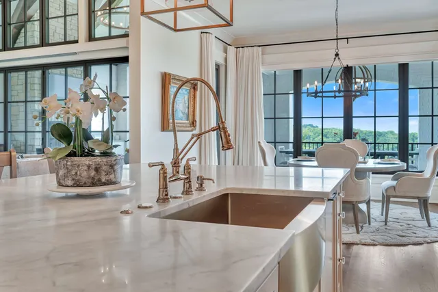 a view of hallway with a window and wooden floor