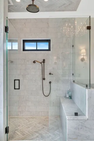 a kitchen with stainless steel appliances granite countertop a sink dishwasher a stove and a refrigerator with wooden floor