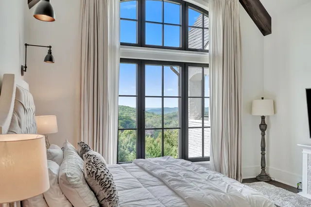an aerial view of a house with garden space and outdoor seating