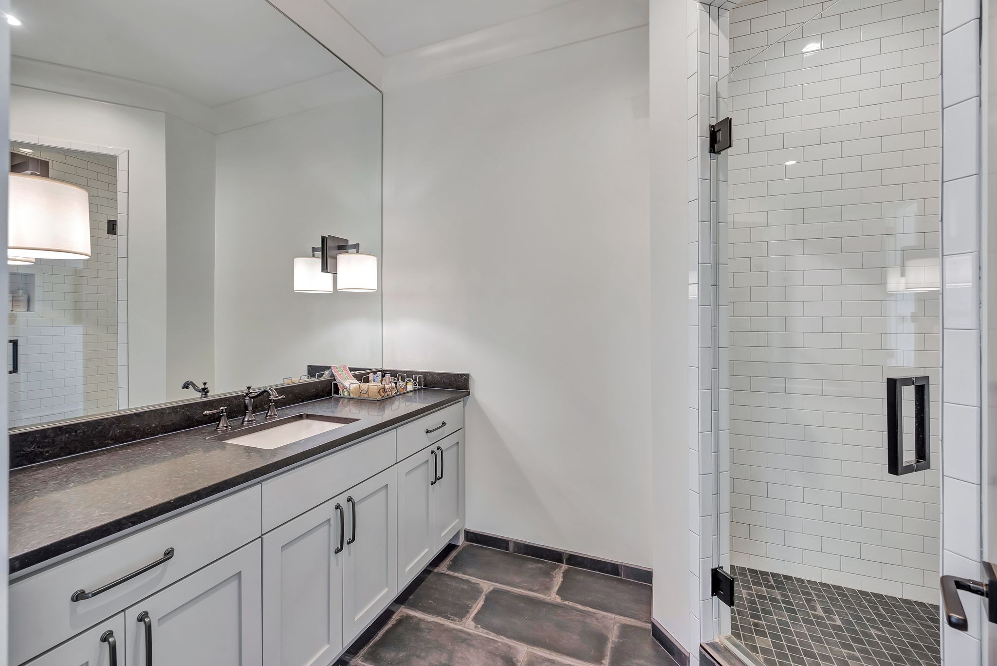 467 Canterbury Rise Franklin, TN 37067 - Photo 79 of 100 a spacious bathroom with a sink and a mirror