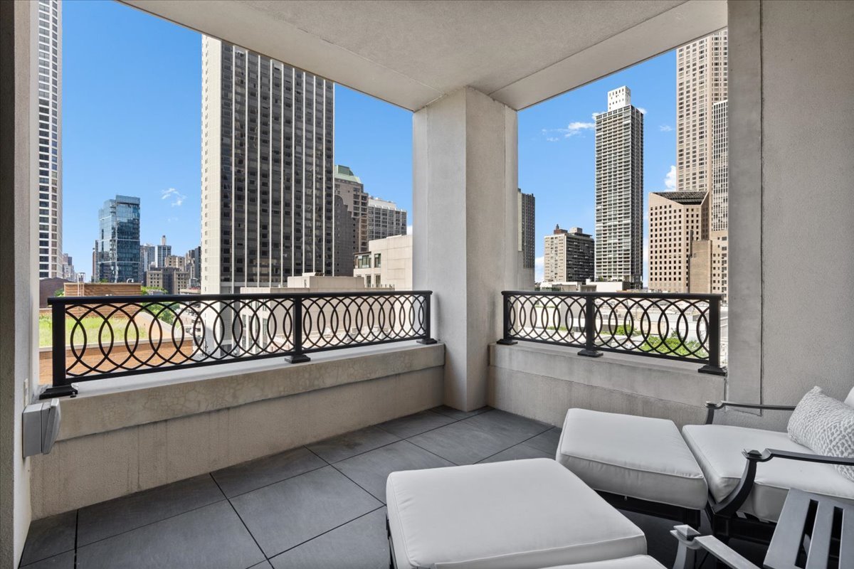 9 West Walton Street, Unit 702 Chicago, IL 60610 - Photo 35 of 38 a living room with furniture and a large window