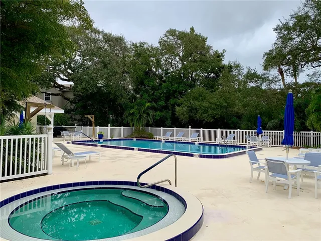 a view of a swimming pool with a patio