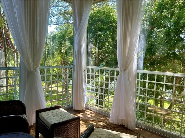 a view of a room that has a bed and a window