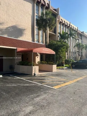 a view of a building with a yard