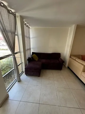 a view of bedroom with furniture and a window