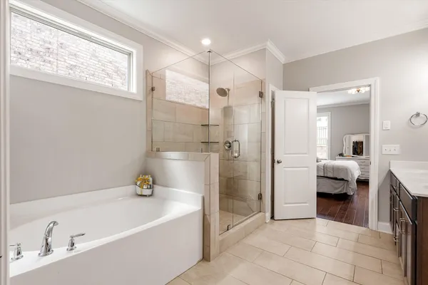 a bathroom with a bathtub and a shower