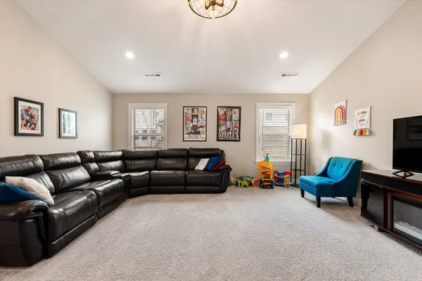 a view of a livingroom with furniture and toys