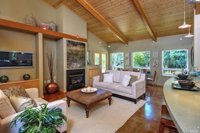 610 Canyon Road Geyserville, CA 95441 - Photo 1 of 1 a living room with furniture a fireplace and a table