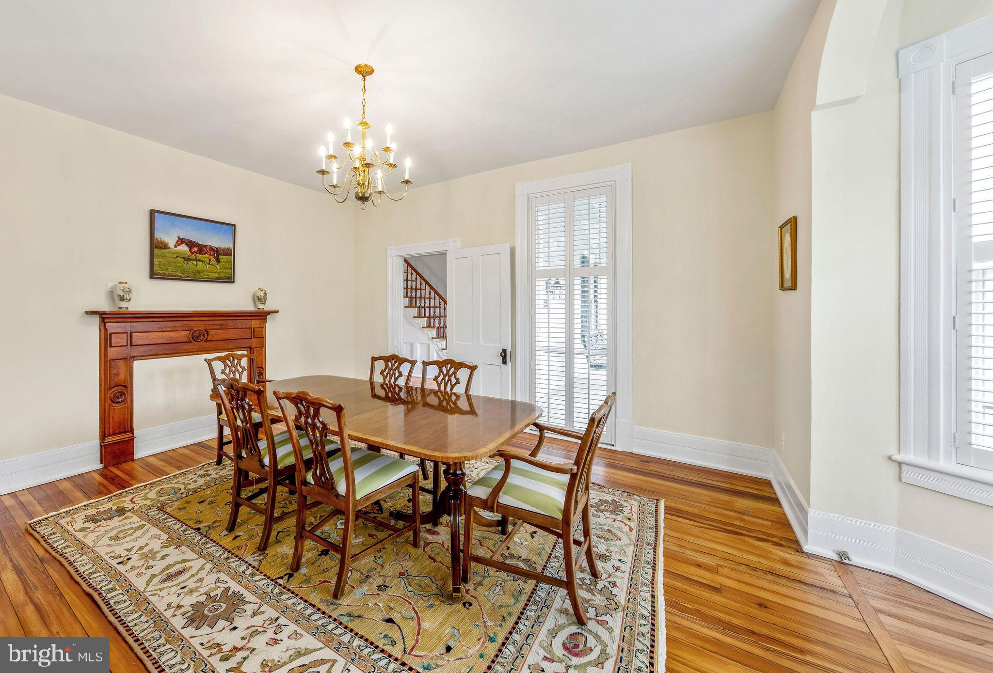 558 Gay Street Washington, VA 22747 - Photo 11 of 52 a view of a dining room with furniture and a chandelier