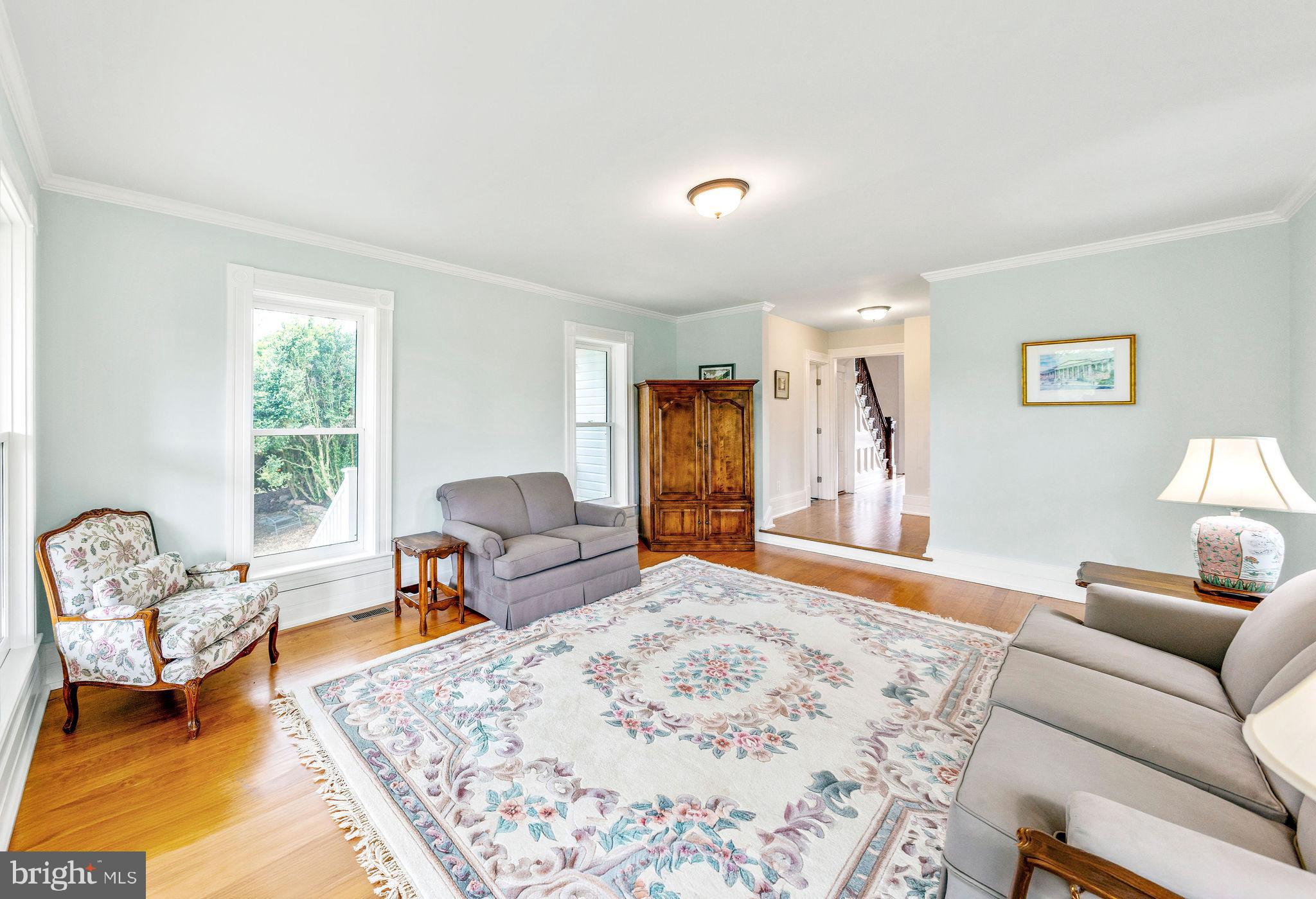 558 Gay Street Washington, VA 22747 - Photo 14 of 52 a bedroom with a bed and wooden floor